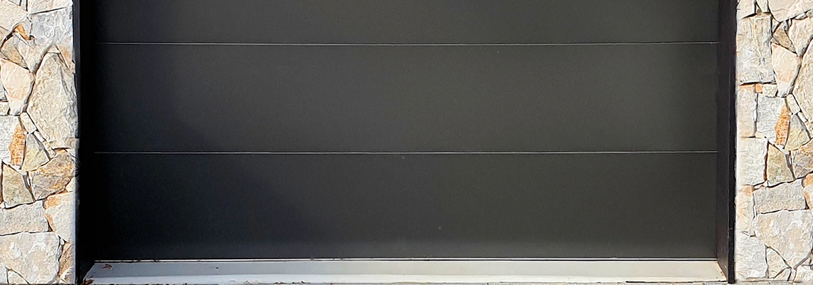 Overhead Black Garage Door Installation in Regent Park, SK
